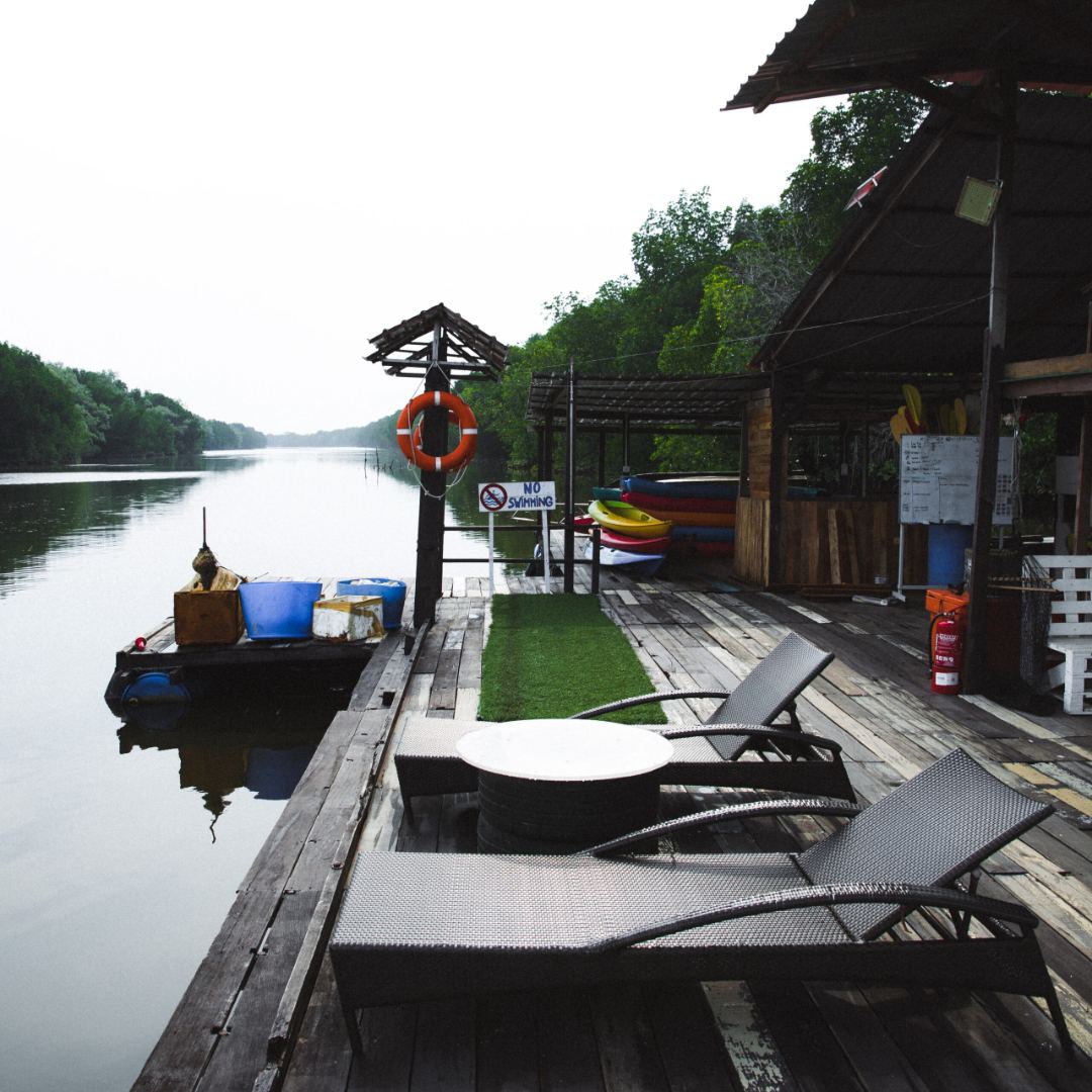 Ecotourism in Malaysia - kayakers paddling through Mangroves